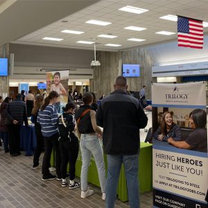 Careers fair with attending people visiting desks